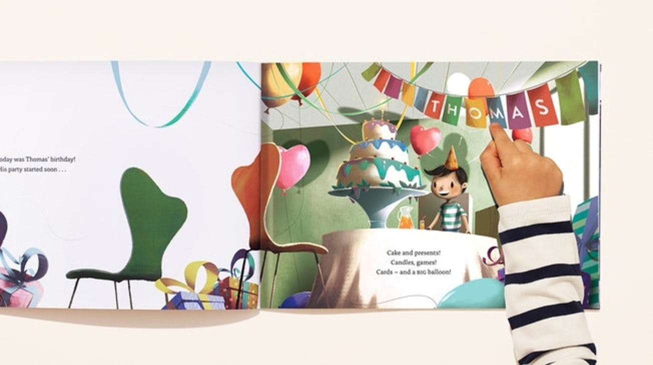 A double spread of your character with your name illustrated in party banners