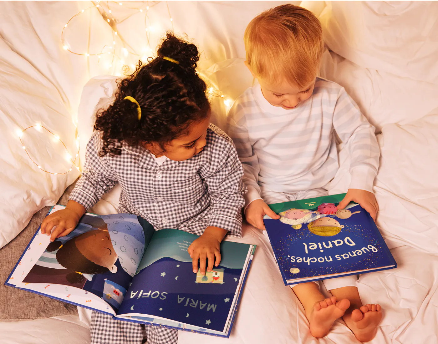 Two children looking at a book - Bedtime For You in Spanish