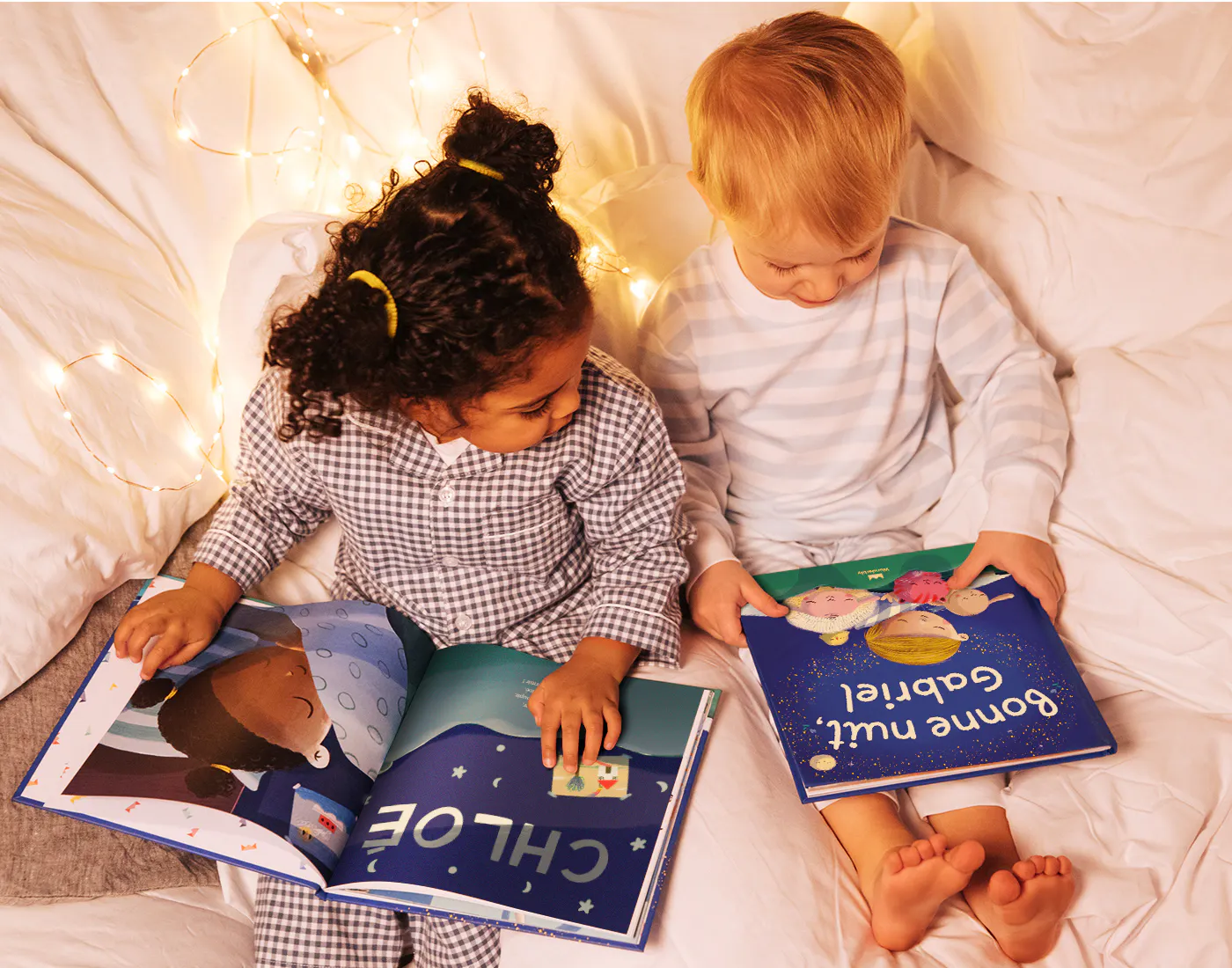 Two children on a bed reading Bedtime For You